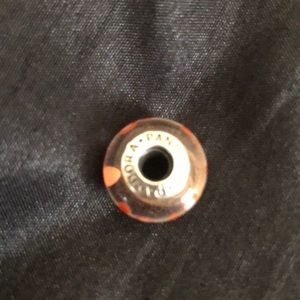 Pandora orange and clear murano.